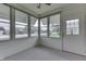 Bright sunroom features ample windows and carpeting at 948 Peppermill Run, Greenwood, IN 46143