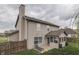 Exterior view of home highlighting the screened porch and lush backyard at 1015 Supernova Dr, Franklin, IN 46131