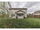 Spacious backyard with lush green grass and mature trees, perfect for outdoor activities at 1015 Supernova Dr, Franklin, IN 46131