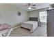 Comfortable bedroom with ceiling fan, carpeted floors, and a sunny window at 1015 Supernova Dr, Franklin, IN 46131