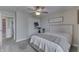 This bedroom features neutral walls, plush carpeting, and a ceiling fan with a light fixture at 1015 Supernova Dr, Franklin, IN 46131
