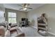 This flex space features neutral walls, plush carpeting, and a ceiling fan with a light fixture at 1015 Supernova Dr, Franklin, IN 46131
