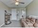 This flex space features neutral walls, plush carpeting, and a ceiling fan with a light fixture at 1015 Supernova Dr, Franklin, IN 46131