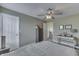 Inviting bedroom showcases an open doorway, natural light, and soothing paint color at 1015 Supernova Dr, Franklin, IN 46131