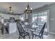Eat-in kitchen with a round table, stylish chairs, and sliding doors to the backyard patio at 1015 Supernova Dr, Franklin, IN 46131