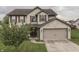Charming two-story home featuring a brick and siding exterior with a two-car garage at 1015 Supernova Dr, Franklin, IN 46131