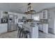 Well-equipped kitchen with stainless steel appliances, white cabinets, and a functional center island at 1015 Supernova Dr, Franklin, IN 46131