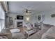 Comfortable living room with a fireplace, ceiling fan, and large sofa for relaxing at 1015 Supernova Dr, Franklin, IN 46131
