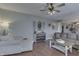 Comfortable living room featuring a ceiling fan and a console table beneath an arched window decoration at 1015 Supernova Dr, Franklin, IN 46131