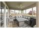 Relaxing screened porch featuring comfortable seating, a table, and views of the backyard at 1015 Supernova Dr, Franklin, IN 46131