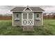 Backyard storage shed with double doors and flower boxes provides organized outdoor storage at 1015 Supernova Dr, Franklin, IN 46131