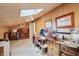 Versatile attic space with natural light, wood paneling, and creative potential at 1030 Stratford Hall # 17-3, Indianapolis, IN 46260