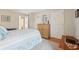 Well-lit bedroom featuring stylish decor and wooden accents, including hardwood floors at 1030 Stratford Hall # 17-3, Indianapolis, IN 46260