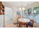 Bright breakfast nook featuring a dining table and a large window with natural light at 1030 Stratford Hall # 17-3, Indianapolis, IN 46260