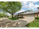 Charming townhome featuring a brick facade, attached garage, and landscaped front yard at 1030 Stratford Hall # 17-3, Indianapolis, IN 46260
