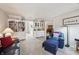 Comfortable living room with bookshelves, seating, and open layout at 1030 Stratford Hall # 17-3, Indianapolis, IN 46260
