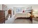 Carpeted main bedroom with a large bed and decorative pillows at 1030 Stratford Hall # 17-3, Indianapolis, IN 46260
