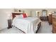 Spacious main bedroom with decorative comforter and two dressers at 1030 Stratford Hall # 17-3, Indianapolis, IN 46260