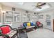 Sunroom featuring skylights, lots of windows, and wicker furniture at 1030 Stratford Hall # 17-3, Indianapolis, IN 46260