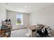 Bright bedroom with a wooden desk by the window at 10358 Pronghorn Ln, Indianapolis, IN 46239