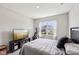 Comfortable bedroom with natural light, neutral paint, and carpet floors at 10358 Pronghorn Ln, Indianapolis, IN 46239