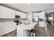 Stylish kitchen featuring white cabinets, stainless steel appliances, and quartz countertops at 10358 Pronghorn Ln, Indianapolis, IN 46239