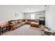 Inviting living room with a plush sectional sofa, decorative pillows, and a cozy atmosphere at 10358 Pronghorn Ln, Indianapolis, IN 46239