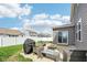 A cozy backyard patio with a fire pit, grill, and comfortable seating, perfect for outdoor entertaining at 10358 Pronghorn Ln, Indianapolis, IN 46239