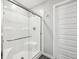 Clean white walk-in shower with a glass door and silver hardware at 10358 Pronghorn Ln, Indianapolis, IN 46239