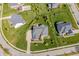 Overhead view of a beautiful brick home with lush green lawn and mature trees in a suburban neighborhood at 10473 Ranford Blvd, Fishers, IN 46040