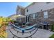 Spacious backyard features outdoor seating, a grill, and a hammock at 10473 Ranford Blvd, Fishers, IN 46040