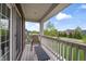 Charming balcony with outdoor seating, offering a peaceful view of the neighborhood and greenery at 10473 Ranford Blvd, Fishers, IN 46040