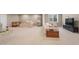 Large basement space featuring play area, living room with neutral colored sofa and bedroom section at 10473 Ranford Blvd, Fishers, IN 46040