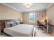 Cozy bedroom featuring natural light, desk space, and neutral decor at 10473 Ranford Blvd, Fishers, IN 46040