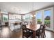 Eat-in kitchen with table and chairs with a view of the backyard through a sliding glass door at 10473 Ranford Blvd, Fishers, IN 46040