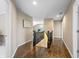 Bright hallway featuring hardwood floors and an open view to the upper level at 10473 Ranford Blvd, Fishers, IN 46040