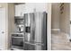 Kitchen features stainless steel appliances, microwave, oven, and staircase at 10473 Ranford Blvd, Fishers, IN 46040