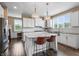 Modern kitchen with white cabinets, a center island, and stainless steel appliances at 10473 Ranford Blvd, Fishers, IN 46040
