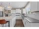 Stylish kitchen featuring a large island, white cabinets, and stainless steel appliances at 10473 Ranford Blvd, Fishers, IN 46040