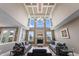 Bright living room featuring a fireplace, large windows, and neutral decor at 10473 Ranford Blvd, Fishers, IN 46040