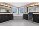 Beautiful main bathroom boasts dual vanities, a soaking tub, and large mirrors at 10473 Ranford Blvd, Fishers, IN 46040
