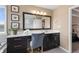 Main bathroom showcasing a dual vanity with dark cabinets and a large mirror, plus a walk in shower at 10473 Ranford Blvd, Fishers, IN 46040