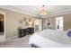 Spacious main bedroom with a tray ceiling, a decorative chandelier, and carpet flooring at 10473 Ranford Blvd, Fishers, IN 46040