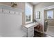 Inviting mudroom area features a built-in desk, bench, coat hooks, and natural light from a large window at 10473 Ranford Blvd, Fishers, IN 46040