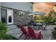 Relaxing backyard patio with outdoor seating, grill, and a beautiful sunset at 10473 Ranford Blvd, Fishers, IN 46040