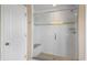 Stylish shower with glass doors, a built-in bench, and decorative tile accents at 10473 Ranford Blvd, Fishers, IN 46040