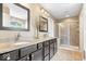 Bathroom featuring double vanity sinks, granite countertops and a glass-enclosed shower at 10531 Cleary Trce, Fishers, IN 46040