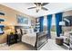 Well-lit bedroom with dark wood furniture, blue curtains, and a comfortable chair at 10531 Cleary Trce, Fishers, IN 46040