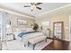 Bright and airy bedroom with modern decor, and dark wood floors at 10531 Cleary Trce, Fishers, IN 46040