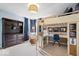 Charming bedroom features a loft bed, desk area, and ample storage, maximizing space at 10531 Cleary Trce, Fishers, IN 46040
